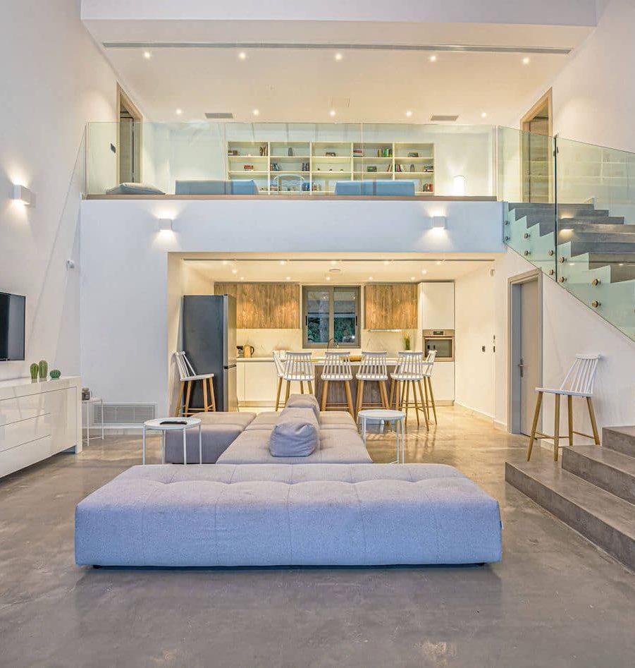 Open-plan lounge, kitchen and upper sitting area at Divine Villa Zakynthos